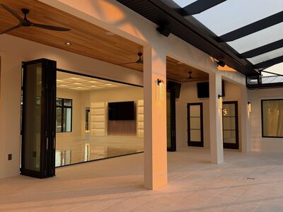 Outdoor porch area showcasing large folding doors