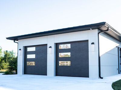 Garage area with two gray separated garage doors